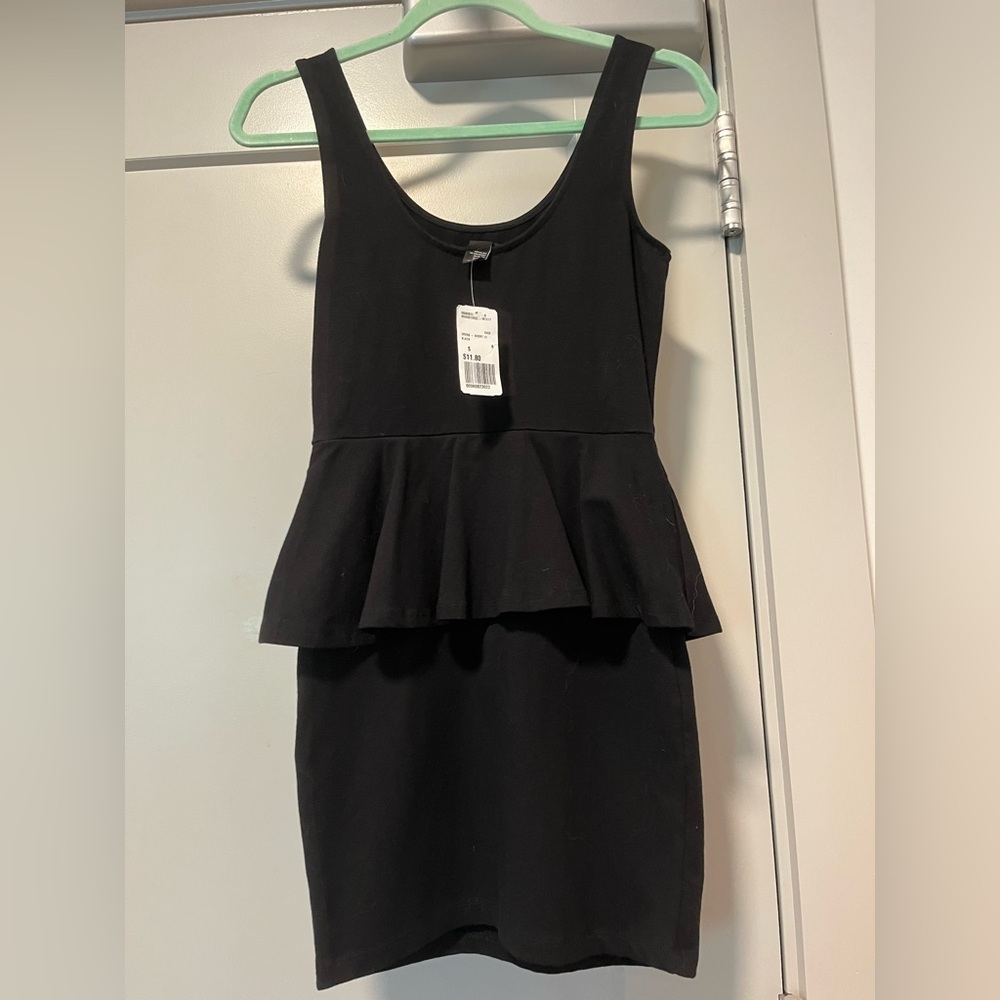 Never Worn. Forever 21 Classic Black Dress with middle of the waist ruffle.